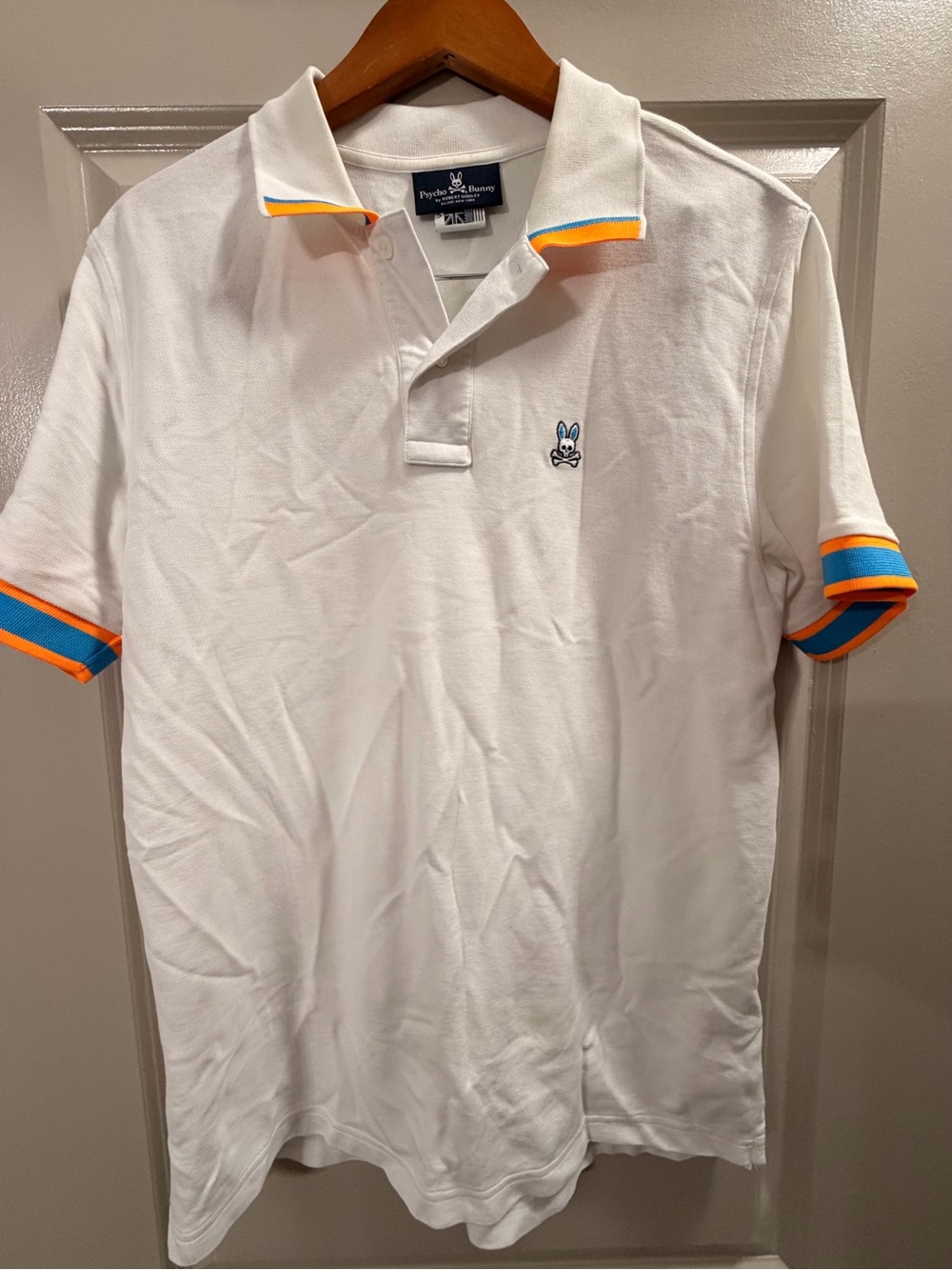 Psycho Bunny White Polo with Blue and Orange Trim